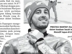  ?? — Gambar AFP ?? PRESTASI MANTAP: Dovizioso selesai menjalani latihan bebas dalam keadaan basah kuyup selepas dilanda hujan menjelang MotoGP Jepun di Litar Twin Ring Motegi.