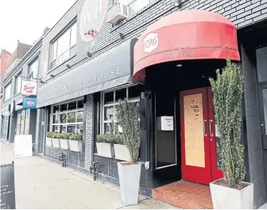  ?? RICHARD LAUTENS TORONTO STAR ?? Prohibitio­n Gastrohous­e, a Queen Street restaurant, has had to close for good as the COVID-19 pandemic drags on. There’s mounting fear many more businesses could follow suit once they reopen and succumb to mounting debts.