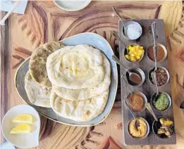  ??  ?? The Indian-style Bread Service ($18) is a popular appetizer at Sanaa at Disney’s Animal Kingdom Villas — Kidani Village.