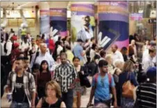  ?? RICHARD DREW — THE ASSOCIATED PRESS ?? New Jersey Transit passengers arrive in New York’s Penn Station, Monday. Amtrak has begun extensive repairs Monday to tracks and signals in Penn Station, which it owns and operates.