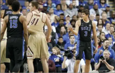  ?? THE ASSOCIATED PRESS ?? Duke’s Grayson Allen, right, reacts after being called for a foul for tripping an Elon player on Wednesday.