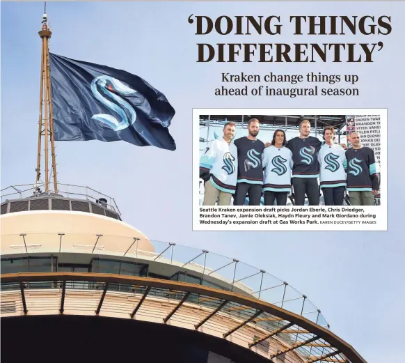  ?? ELAINE THOMPSON/AP ?? A flag with the new logo for the Kraken, the newest NHL team, flies atop the iconic Space Needle in Seattle.