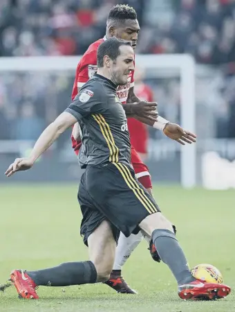  ??  ?? Sunderland’s John O’Shea and Middlesbro­ugh’s Britt Assombalon­ga battle for the ball.