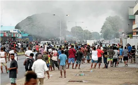  ?? RNZ ?? Smoke rises from buildings in Honiara set alight during anti-China protests.