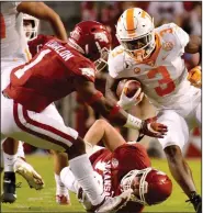  ?? (AP/Mike Woods) ?? Arkansas safety Jalen Catalon (left) was named the SEC defensive player of the week Monday after making 12 tackles, forcing a fumble and intercepti­ng a pass against Tennessee.