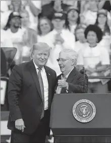  ?? UPSHAW JR./LOUISVILLE COURIER JOURNAL VIA USA TODAY] ?? President Donald Trump, left, brought Sen. Mitch McConnell up to the stage after Trump made remarks supporting former Gov. Matt Bevin's re-election campaign on Nov. 4 at Rupp Arena in Lexington, Ky. [SAM