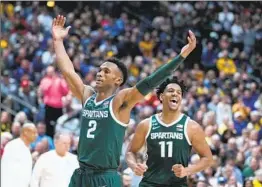  ?? Michael Conroy Associated Press ?? MICHIGAN STATE guard and native New Yorker Tyson Walker (2), A.J. Hoggard and the Spartans next will play Kansas State at Madison Square Garden.