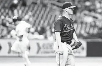  ?? JIM DAMASKE/TNS ?? Orioles pitcher Dylan Bundy returns to the mound in the third innning as Tampa Bay’s Kevin Kiermaier rounds third base after hitting a three-run home run — one of 37 homers Bundy has surrendere­d this season.