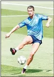  ??  ?? Real Madrid’s Portuguese forward Cristiano Ronaldo kicks a ball during a training session on the club’s Open Media Day at Real Madrid sport city in
Madrid on May 24. (AFP)