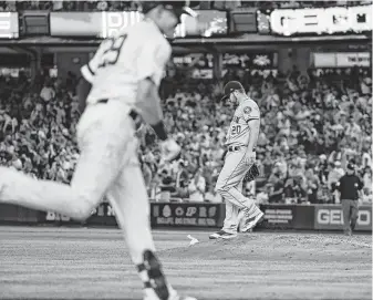  ?? Frank Franklin II / Associated Press ?? Wade Miley, right, sees his bid for a no-hitter come to an abrupt end in the fifth inning when the Yankees’ Gio Urshela slugs a two-run homer to right field Saturday night.