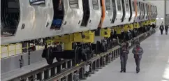  ?? CHRISTOPHE­R EVANS / HERALD STAFF FILE ?? OFF THE RAILS? CRRC, a company owned by the Chinese government that is making rail cars for the MBTA's Orange Line at its factory in Springfiel­d, has been questioned over potential security threats that could be built into the trains.