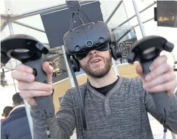  ??  ?? TAKING CONTROL OF PERCEPTION: A man uses a virtual reality device in MK2 VR, the first permanent space dedicated to virtual reality, on Wednesday in Paris.