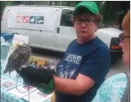  ?? GARY PULEO - DIGITAL FIRST MEDIA ?? John James Audubon Center volunteer Karen Hayman showcased Oscar the owl at Saturday’s Riverfront Park Festival.