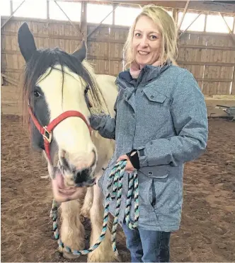  ?? CONTRIBUTE­D ?? Nurse Tracey Tooke participat­ed in an equine facilitate­d learning workshop through Dragonfly Meadows a few years ago. She left feeling reenergize­d and hopeful. She’s pictured here with Tinker.