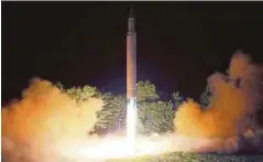  ??  ?? GAMBAR yang disiarkan agensi berita Korea Utara menunjukka­n pelancaran roket ICBM Hwasong-14 di satu lokasi rahsia kelmarin. - AFP