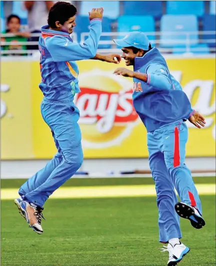  ??  ?? India’s Deepak Hooda (left) and Sanju Samson celebrate after the fall of a England batsman in Dubai on Saturday.