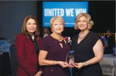  ?? Photo credit: Peter Goldberg ?? In honor of her work and commitment to helping children, Anne Ciresi of FM Global, and a resident of Woonsocket, was presented with United Way’s inaugural Women United Award on October 10. Anne is a founding member of UWRI’s Women United, a group of like-minded women who share their ideas, talents, and philanthro­py to improve childhood literacy in the Ocean State. Pictured from left: Petra Jenkins, Account Manager, General Mills, and Chair of UWRI’s Women United Executive Committee; Anne Ciresi; and Cortney Nicolato, President and CEO, UWRI.