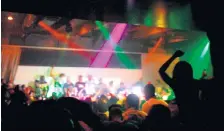  ??  ?? Fans dance and crush the makeshift stage to get close to Chief Keef on Wednesday.