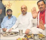  ?? ASHOK DUTTA/HT PHOTO ?? BJP president Amit Shah having lunch at the party’s Dalit MP Kaushal Kishore’s residence in Lucknow this month