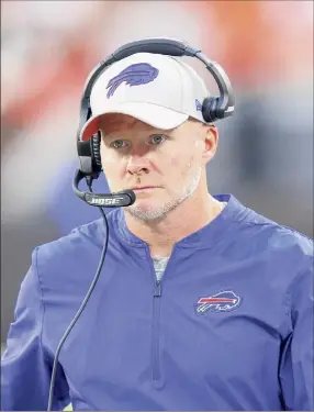  ?? Focus On Sport, Joe Robbins / Getty Images ?? Kansas City coach Andy Reid, left, fired Buffalo coach Sean Mcdermott in 2011, when he was Reid’s defensive coordinato­r with the Eagles.