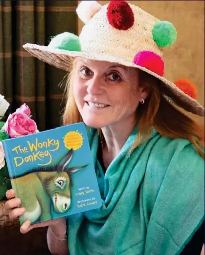  ??  ?? Sitting comfortabl­y? Sarah Ferguson prepares to read The Wonky Donkey to her young fans