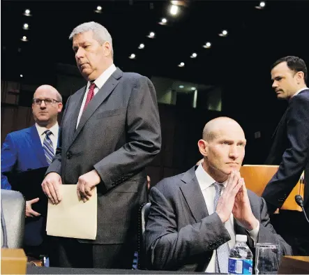  ?? THE ASSOCIATED PRESS/FILES ?? While Valeant’s then CEO Michael Pearson, forefront left, and former chief financial officer Howard Schiller, right, are not accused of wrongdoing in a new case against two former employees of Valeant and Philidor, the drugmaker is co-operating with...