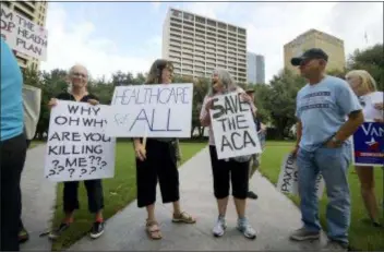  ?? MAX FAULKNER — STAR-TELEGRAM VIA AP ?? Supporters of the Affordable Care Act protest during a rally at Burnett Park in Fort Worth, Texas, Wednesday. Democratic nominee for Texas Attorney General Justin Nelson hosted the Fort Worth Rally for Preexistin­g Coverage Protection.