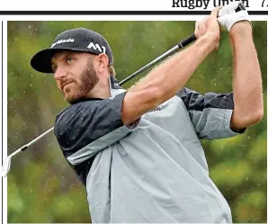  ?? AP ?? Eyes on the prize: Johnson hits an iron off the fourth tee