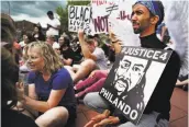  ?? Richard Tsong-Taatarii / Associated Press ?? Protesters march against the acquittal of a police officer, who was found not guilty for shooting Philando Castile during a traffic stop in St. Anthony, Minn.