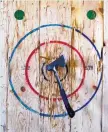  ?? GREG SORBER/JOURNAL ?? ABQ Ax allows visitors to throw axes at a bullseye.