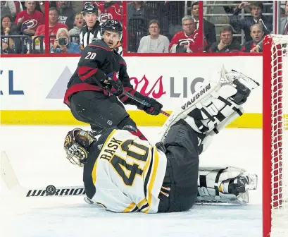  ?? GREGG FORWERCK GETTY IMAGES ?? Sebastian Aho and the Hurricanes fired 20 shots at Bruins netminder Tuukka Rask in the first period of Tuesday night’s Game 3 of the NHL Eastern final. Rask stopped all of them, the most saves by a Boston goalie in a single period in the post-season since 2011.