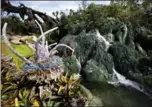  ?? JOHN RAOUX, THE ASSOCIATED PRESS ?? Sculpted Pandora flora is surrounded by ponds and gentle waterfalls at Pandora — the World of Avatar.