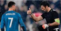  ?? AFP ?? Show of respect: Juve’s keeper Buffon hails the genius of Ronaldo at final whistle