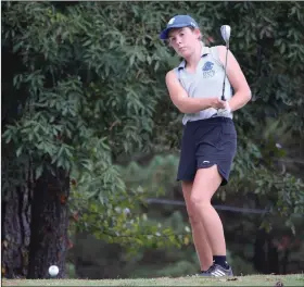  ?? (The Sentinel-Record/Krishnan Collins) ?? Bismarck’s Anna Cain chips onto the green during the Class 3A girls state golf tournament Wednesday at Glenwood Country Club in Glenwood. Cain earned medalist honors with a low round of 76.