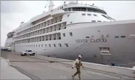  ?? ASSOCIATED PRESS FILE PHOTO ?? A police officer walks past the the Silver Cloud cruise ship at the 2016 Summer Olympics in Rio de Janeiro, Brazil, last August.