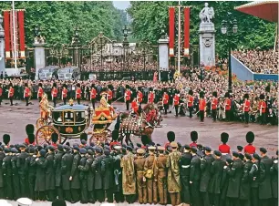  ??  ?? Flying squad: RAF personnel watching the Coronation parade in June 1953