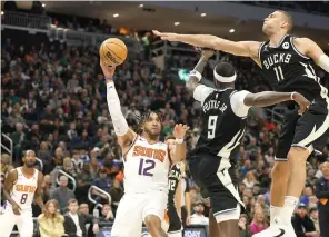  ?? ?? Phoenix Suns forward Ish Wainright (12) looks to pass the ball against the Milwaukee Bucks Sunday during the second half of an NBA basketball game in Milwaukee. (AP photo/Jeffrey Phelps)