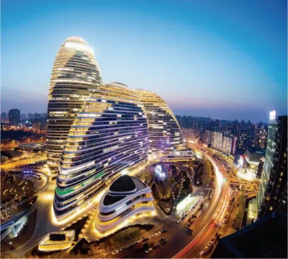  ??  ?? Wangjing SOHO, designed by Zaha Hadid, in Beijing, China. Completed in 2014, the building complex consists of three high-rises integratin­g offices and commerce, with designed floor area totaling 520,000 square meters. CFP