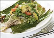  ?? PHOTOGRAPH­Y PHOTO COURTESY OF SOUTH MOON ?? Echoes of Yucatan: Chef Lindsay Autry’s Florida snapper cooked in banana leaves is a classic at The Regional Kitchen in West Palm Beach.
