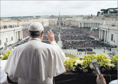  ??  ?? The Associated Press Pope Francis delivers the Urbi et Orbi blessing at the end of his Easter Sunday Mass in St. Peter’s Square at the Vatican.