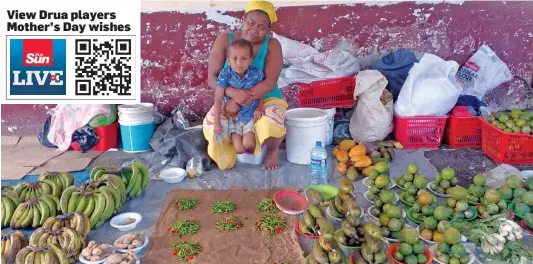  ?? Photo: Salote Qalubau ?? Mary Elizabeth Fong with her second youngest son Salimoni Tabua at the Lautoka Market on May 8,2022.