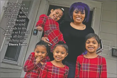  ?? (AP/Charles Krupa) ?? Dinora Torres, a MassBay Community College student, poses with her four daughters on the front porch of their home in Milford, Mass. From front left are daughters Davina, Alana and Hope, with Faith in Dinora’s arms. At the college, applicatio­ns for meal assistance scholarshi­ps have increased 80% since last year. Among the recipients is Torres, who said the program helped keep her enrolled.