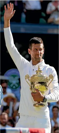  ?? AP ?? Novak Djokovic overtook Roger Federer in the Grand Slam title standings and moved within one of Rafael Nadal by claiming his 21st major trophy at Wimbledon.