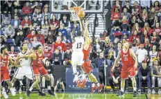  ?? BOB TYMCZYSZYN/STANDARD STAFF ?? More than 3,200 fans were treated to a thriller in men's university basketball Saturday night at Meridian Centre in St. Catharines. Carleton defeated Brock in overtime.