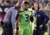  ?? RICK SCUTERI — THE ASSOCIATED PRESS FILE ?? Seahawks QB Russell Wilson (3) speaks with head coach Pete Carroll, right, and assistant Tom Cable during a game against the Cardinals in Glendale, Ariz.