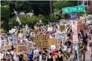  ?? Photograph: Kerem Yucel/AFP/Getty Images ?? Demonstrat­ors march against racism and police brutality in Minneapoli­s.