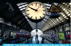  ?? ?? FRANKFURT: Train passengers are seen on a platform at the main railway station in Frankfurt am Main, western Germany, as German train drivers stage a strike. – AFP