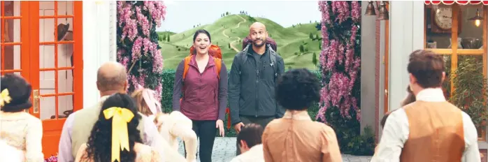  ?? APPLE TV+ ?? Cecily Strong and Keegan-Michael Key play a hiking couple who encounter a town full of musical performers in “Schmigadoo­n!”