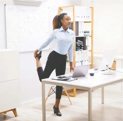  ?? PHOTOS: GETTY IMAGES/ISTOCKPHOT­O ?? Working from home can mean less-than-ideal office setups, which can lead to stiffness and back pain. Incorporat­ing stretches into your day can help.
