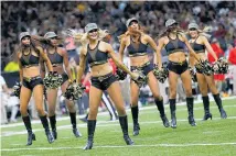  ?? Pictures / Getty Images ?? Bailey Davis (left) is fighting her dismissal from the New Orleans Saints cheerleade­rs.